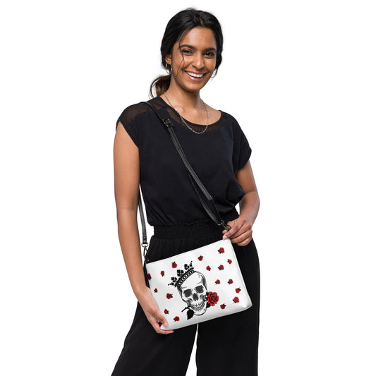 Skull in Crown Surrounded by Roses Crossbody Bag by EraofInk